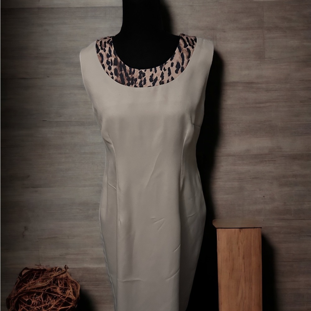 Tan sheath dress with leopard  animal print trim.